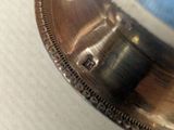 a close up picture of a coin on a table