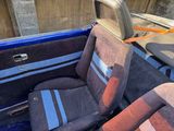 two seats in the back of a blue truck