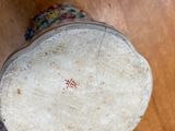 a close up view of a drum on a wooden floor