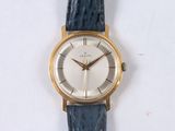 a watch that is sitting on a white surface