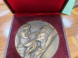 an image of a medal in a box on a table
