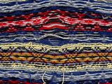 a close up of a multicolored striped fabric