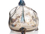 an image of a glass vase with a bird on it