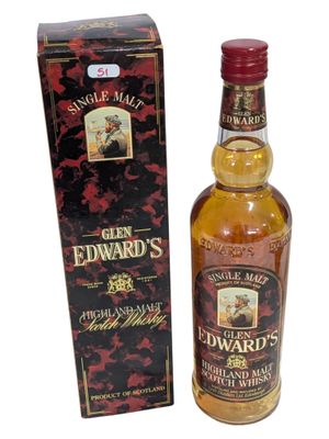 une photo d'une bouteille de whisky « Edward » à côté d'une boîte