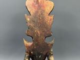 a close up of a wooden object with a bird on it