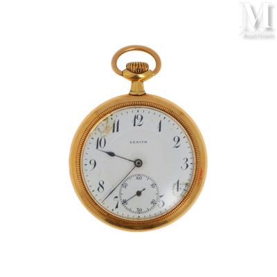 a gold pocket watch with roman numerals on the face