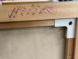 a close up of a piece of wood with writing on it
