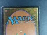a close up of a magic the gathering card on a table