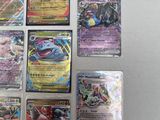a lot of pokemon cards on the table