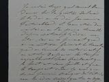 une vieille lettre écrite à la main sur un morceau de papier avec une écriture dessus