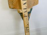 an old wooden baseball bat sitting on top of a wooden table