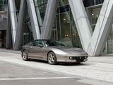 a silver car that is parked in front of a building