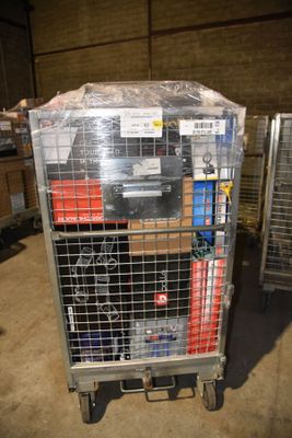 a metal cart with many items in it in a warehouse