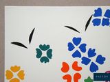 a picture of a painting of flowers on the wall