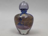 a glass bottle with a purple and gold design on it