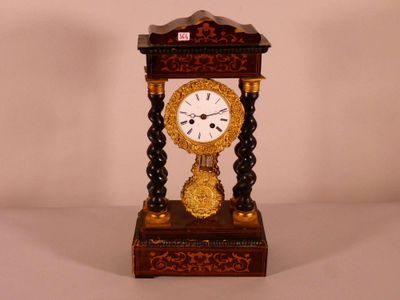 a small clock that is sitting on a table