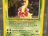 the pokemon card is in a clear plastic case