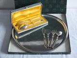 a tray with silverware on it and a box with spoons and spoons