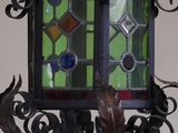 a lamp that has a stained glass window on it