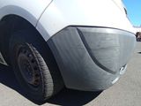 a close up of a car ' s tire on a parking lot