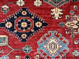 an image of a red and blue rug with a pattern on it