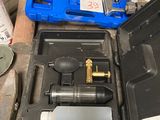 a tool in a case that is sitting on the floor