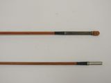pair of antique wooden canes on a white background
