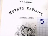 un vieux livre sur lequel figure le dessin d'un homme et d'une femme