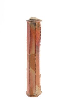 a picture of a copper colored vase on a white background