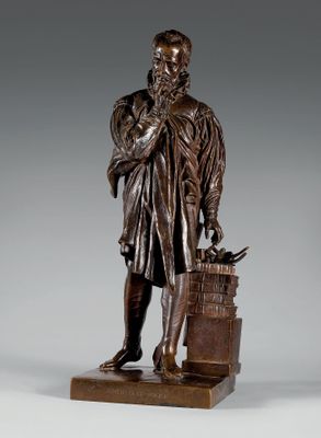 statue en bronze représentant un homme avec un oiseau sur l'épaule