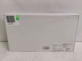 the back of a white box with a green sticker on it