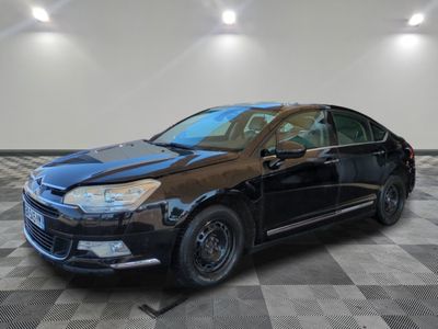 a picture of a black car parked in a garage