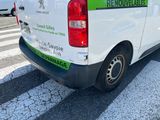 a white van that is parked on the side of the road