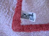 a label on a towel with a horse drawn on it