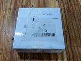 an image of a box of ear buds sitting on a wooden table