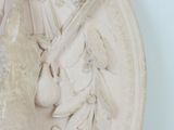a statue of a woman holding a sword in her hand