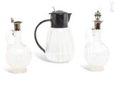 three glass vases and a glass pitcher on a white background