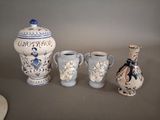 three vases that are sitting next to each other on a table