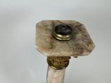 a marble table top with a brass plate on it