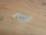a piece of wood that has a label on it