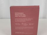 the book is sitting on a white surface with a white background