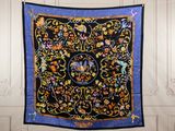 an image of a black and blue quilt hanging on a wall