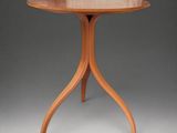 a small table with a wooden top and a wooden base