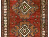 a red and blue rug with geometric design