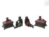three figurines of a man and a woman sitting on a bench