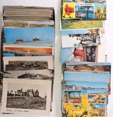 a lot of postcards on a table with a bunch of them