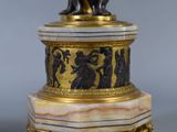 a statue of a man and a woman on a pedestal