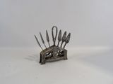 a metal knife holder that has knives in it