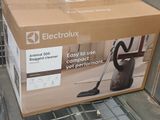 boxes of vacuum cleaners are stacked on top of each other in a store