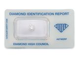 a white diamond with a diamond identification report on top of it